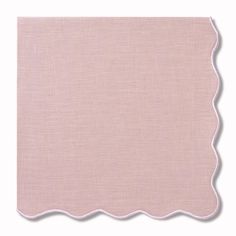 a pink place mat with scalloped edges