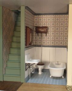 a bathroom with a toilet, sink and bathtub in the middle of the room