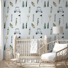 a baby's room with a crib, rocking chair and wallpaper