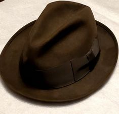 Vintage Royal Stetson Chocolate Brown Felt Fedora Hat Size 7 1/8.  Shipped with USPS Priority Mail. Very nice Chocolate Brown Royal Stetson Felt Fedora with a Black 2" Wide Ribbon. Has a brown leather sweatband and a light brown satin lining. Hat dates to the 1950's. Very good pre-owned condition, only the sweatband shows signs of wear and has a tear at the back. Please check out all of the pictures for condition and message me if you have any questions or would like to see additional pictures. Fedora Hat Aesthetic, Journalist Outfit Men, 60s Detective, Fedora Aesthetic, Detective Hat, Detective Outfit, 1930s Men, Brown Fedora, Detective Aesthetic