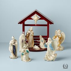 a nativity scene with figurines in front of it