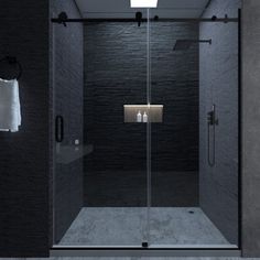 a walk in shower sitting inside of a bathroom next to a white towel hanging on the wall