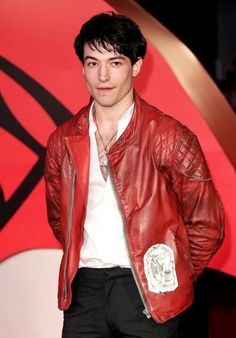 a man in a red leather jacket and white shirt