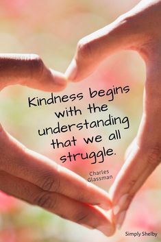 two hands making a heart shape with the words kindness begins with the underhanding that we all struggle