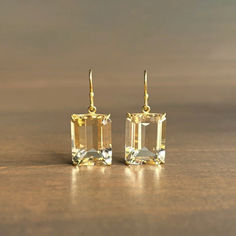 The glistening champagne tones in these opulent citrines will make every day a soirée.

18k gold setting, 14k gold ear wires
Citrines 13mm x 16mm (1/2" x 5/8")
Earrings hang 1 1/8" from the ear 
Each earring weighs 3.3g Citrine Earrings, Free Gems, Emerald Cut, Ear Wires, Precious Metals, Citrine, Champagne