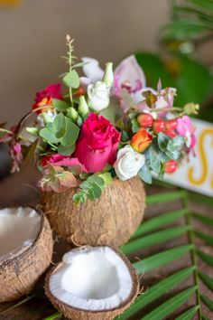 some flowers and coconuts on a table