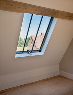 an empty room with a skylight in it