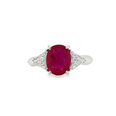 This 18K white gold stunning ring is from our Timeless Collection. It is made of a beautiful oval shape ruby in total of 3.06 Carat decorated by 2 colorless trillion shape diamonds in total of 0.70 Carat. Total metal weight is 5 gr. Extraordinary piece for any occasion! The Timeless Collection was inspired by the endless elegance and sophistication of classic high-jewelry, eternising it’s beauty and presenting a selection of classy designs. The intense colours stones give the collections authent Gia Certified Oval Ruby Ring, Luxury Oval Diamond Ring With Lab-created Ruby, Oval Ruby Ring With Diamond, Elegant Gia Certified Oval Ruby Ring, Lab-created Ruby Ring With Brilliant Cut In Oval Shape, Classic Oval Lab-created Ruby Diamond Ring, Formal Oval Ruby Ring In Platinum, Oval Ruby Ring In Platinum For Formal Occasions, Luxury Oval Ruby Ring With Accent Stones