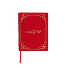 a red notebook with gold lettering on it