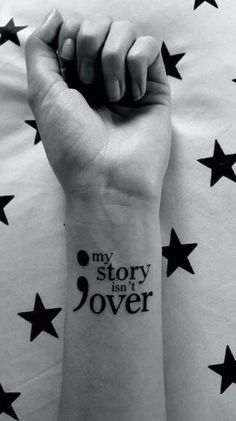 a woman's arm with stars on it that says, my story is in jover