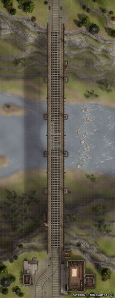 an aerial view of a train track and water