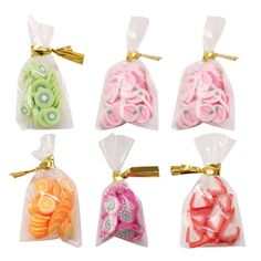 six bags filled with different types of candies