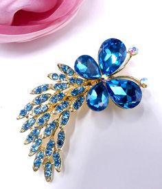 "Vintage pretty gold tone and blue rhinestone butterfly with tail pin brooch, In very good condition, It's 2'3/4 long 1\"1/4 wide, Thanks" Blue Butterfly Accessories, Elegant Blue Butterfly Brooches, Butterfly With Tail, Mertensia Virginica, Vintage Gold Brooch, Stone Bangles, Delicate Jewellery, Gold Brooch, Stone Bangle