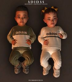 two children wearing adidas tracksuits and headbands