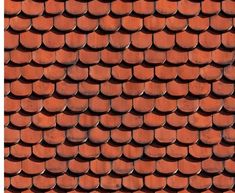 a red roof with many rows of tiles on it's sides and the top half of