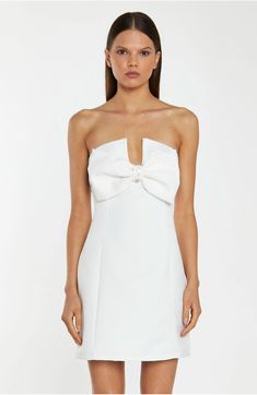 Glamorous Women's Off-White Satin Strapless Bow Mini-Dress. This Off-White Strapless Mini Dress is the ultimate showstopper! Its statement bow design, tailored fit, and mini length are sure to turn heads. Its sparkling diamante trim details finishes off the look perfectly! FEATURES Statement Bow Design Strapless Tailored Fit Mini Length Diamante Trim Details Fully lined Concealed Zip Fastening at the Back Composition: Shell 100% Polyester, Lining 100% Polyester Model Wears Size 10. Model Height: Chic Strapless Mini Dress With Detachable Bow, Formal Strapless Mini Dress With Bow, Formal Strapless Mini Dress With Bow Tie Back, White Mini Dress With Bow For Night Out, White Dresses With Detachable Bow, Elegant Mini Dress With Bow Tie For Formal Occasions, Elegant Bow Tie Mini Dress For Formal Occasions, Elegant Formal Mini Dress With Bow Tie, Strapless Mini Dress With Bow For Gala