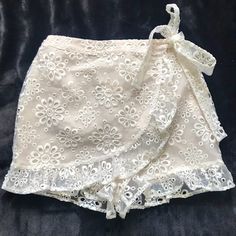 Revolve Lovers & Friends Faux Wrap Organza Shorts Cream Elastic Pull On Faux Wrap Shorts Embroidered Organza Ruffle Hem Waist 13” Stretches To 16” New Without Tags White Lace Bottoms For Brunch, Fitted Lace Bottoms For Day Out, White Lace Brunch Bottoms, Spring Lace Bottoms For Day Out, Feminine Short Bottoms For Party, Chic Lace Bottoms For Vacation, Feminine Short Length Bottoms For Brunch, Friends Shorts, Wrap Shorts