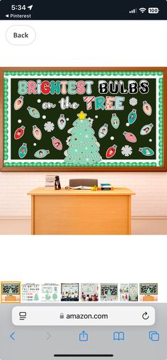 an image of a christmas tree on a blackboard in front of a computer screen