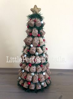 a small christmas tree made out of rocks