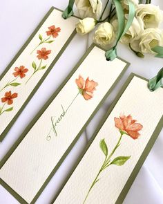 three cards with watercolor flowers on them