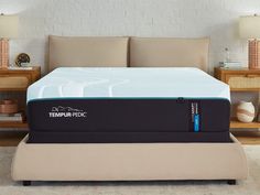 the tempur - pedic mattress is in front of a bed with two nightstands