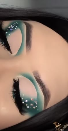 Green Eyeshadow Looks With Rhinestones, Blue Eyeshadow Looks With Rhinestones, Rhinestone Eyeliner Makeup, Light Blue Silver Eye Makeup, Green Makeup Looks For Prom, Makeup Ideas Rhinestones, Green Prom Makeup Looks, Eye Looks With Rhinestones, Dark Green Makeup Looks