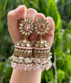 Beautiful engraved Jhumka earrings available in 2 stunning variations of pink and green. These earrings are high quality and are made to last. They are not too heavy and will be fine to wear all day long. They surely add a statement to any look! In case of any queries, please feel free to reach out. Happy shopping! Luxury Traditional Kundan Jhumkas, Luxury Jhumkas With Intricate Design For Formal Occasions, Cheap Festive Jhumkas For Navratri, Cheap Round Jhumkas With Latkans, Luxury Kundan Jhumkas With Zari Work, Luxury Green Jhumkas For Diwali, Cheap Multicolor Jewelry For Diwali, Luxury Multicolor Earrings For Diwali, Luxury Kundan Jhumkas For Festive Season