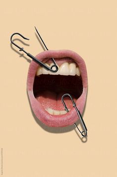 an open mouth with two pairs of scissors in it's mouth and one pair of teeth