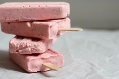 three popsicles stacked on top of each other with toothpicks sticking out of them