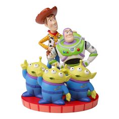 the toy story figurine is posed on top of three smaller figures, including buzz and woody