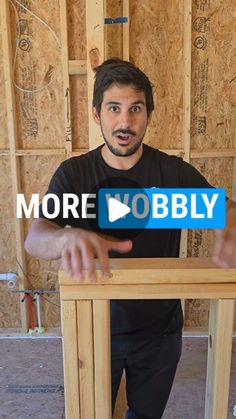 a man standing in front of a wooden table with the words more bobly on it