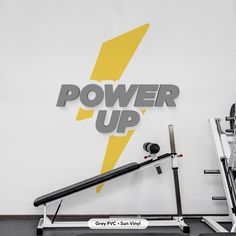 the gym equipment is on display in front of a power up sign