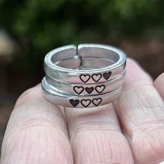 Each of these rings is adjustable and made of sturdy aluminum, which is lightweight but strong. They're also perfect for stacking! This listing comes with three rings. ♥ ♥ ♥ ♥ ♥ ♥ ♥ ♥ ♥ ♥ ♥ ♥ ♥ ♥ ♥ ♥ ♥ ♥ ♥ ♥ ♥ ♥ These inspirational rings are engraved with love and polished to a beautiful shine.  They're adjustable and made of sturdy aluminum, which is lightweight but because these are thicker bands, they're very strong. They're also perfect for stacking! Pick your perfect mantra for a daily remi Adjustable Metal Heart Ring For Valentine's Day, Adjustable Stackable Heart Ring As Gift, Adjustable Metal Midi Rings For Gifts, Adjustable Metal Midi Rings As Gift, Adjustable Metal Midi Rings Gift, Adjustable Metal Ring For Anniversary, Adjustable Metal Rings For Anniversary, Adjustable Open Heart Ring For Anniversary, Handmade Adjustable Heart Ring