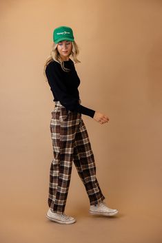 These pants feature a classic plaid pattern with a high-rise waist for a flattering fit. The four-pocket design adds functionality to fashion, and the fleece exterior ensures warmth and coziness. Elevate your winter wardrobe with these versatile and chic plaid pants. zip-fly with button closure function pockets unlined // paired with the Beverly balloon sleeve sweater in black + the vintage goods foam trucker hat *FINAL SALE* Cozy Cotton Pants For Fall, Black Retro Fall Pants, Retro Winter Trousers, Retro Plaid Pants For Fall, Retro Straight Leg Pants For Fall, Brown Bottoms With Hip Pockets For Fall, Fall Brown Bottoms With Hip Pockets, Cozy Fall Bottoms With Pockets, Trendy Plaid Winter Bottoms