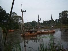 an old boat is sitting in the water