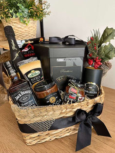 a basket filled with lots of food and condiments on top of a table