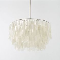 a white chandelier hanging from a ceiling