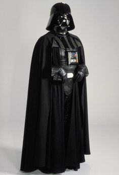 darth vader from star wars standing in front of a white background