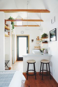 two stools are in front of the kitchen counter