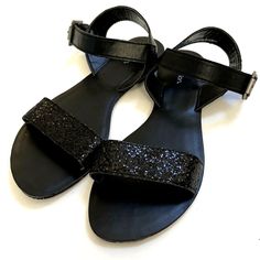 Beautiful Xhilaration Sandals. Heel Height - 0-1" Slip-On Sandal Slide Glitter Upper Design Memory Foam Foot Bed For Comfort Shoe Width - Medium Rubber Spot Clean Measurements: Heel Height: 12 In Weight: 15 Oz New Without Box. Impeccable Condition. Size: 7 Color: Black (Sparkling) Item Comes From A Smoke & Pet Free Home. Adjustable Glitter Sandals For Party, Party Sandals With Glitter And Adjustable Fit, Sequin Open Toe Sandals For Night Out, Glitter Accents Ankle Strap Sandals For Night Out, Glitter Ankle Strap Sandals For Night Out, Glitter Accented Ankle Strap Sandals For Night Out, Adjustable Round Toe Sandals For Night Out, Black Sparkling Open Toe Sandals, Glamorous Black Glitter Sandals