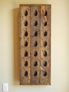 a wooden peg board mounted to the wall