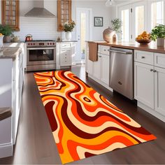 an orange and red area rug in a kitchen