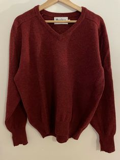 Vintage Men's Harley V-neck sweater.  Color is red. Size large. Fabric is 100% lambswool. Made in Scotland. Cleaned and ready to wear. Measurements (in inches) Chest 25 Waist 23 Sleeve Length 23 1/2 Length 26 1/2 Measurements are taken across the back with garment lying flat. Chest measurement is "pit to pit".   I do my very best to make note of any of imperfections in the item details, but I may overlook some small flaws. I do my best to include sizing & condition with each product.  Please fee Classic Long Sleeve Lambswool Sweater, Wool V-neck Polo Sweater For Fall, Wool V-neck Sweater With Ribbed Cuffs, V-neck Wool Sweater With Ribbed Cuffs, Vintage Long Sleeve V-neck Sweater For Winter, Wool V-neck Sweater For Winter, Vintage V-neck Sweater For Fall, Casual Wool Polo Sweater With V-neck, Casual Wool V-neck Polo Sweater