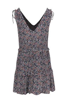 Looking for that perfect dress to transition from the fall into the summer months? This Rails mini dress is just what you are looking for! The frilly, floral print dress features tiered ruffles and tie-up shoulder straps that make this dress adjustable for your comfort. Though it is lightweight, it can easily transition into the fall months when layered over a T-shirt or turtleneck top. Slip this on for your weekend activities and look great! Size XS Shell: 70% Rayon, 30% Viscose Lining: 100% Po Patterned Dress With Ruffle Hem For Spring, Patterned Spring Dresses With Ruffle Hem, Spring Patterned Dresses With Ruffle Hem, Sleeveless Floral Print Mini Dress For Fall, Casual Floral Print Mini Dress, Ditsy Floral Print Tiered Sundress, Flowy Floral Print Mini Dress, Casual Floral Ruffled Dress For Daywear, Sleeveless Floral Print Patterned Mini Dress