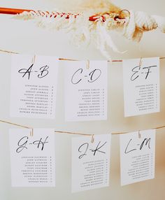 wedding seating chart hanging on clothes pins