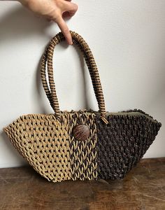 Vintage Woven Straw Tote | Natural Straw Shoulder Bag | Black & Tan Straw Purse Awesome vintage find! This gorgeous boho purse is everything for the summer season. Take it to the beach or a festival. In good condition. Some minor staining on inner lining from age and general use (pictured). Measurements: 20w5d9h Vintage Beach Satchel Shoulder Bag, Vintage Brown Woven Bag, Vintage Satchel Shoulder Bag For Beach, Vintage Beach Shoulder Bag With Braided Handles, Vintage Straw Shoulder Bag For Travel, Vintage Woven Shoulder Bag For Vacation, Vintage Summer Shoulder Bag With Handles, Vintage Brown Woven Shoulder Bag, Vintage Beach Bag For Vacation