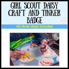 the girl scout daisy craft and tinker badge is shown with her hands on paper