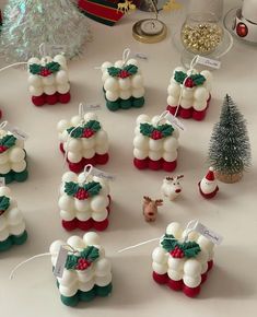 christmas decorations are displayed on a table