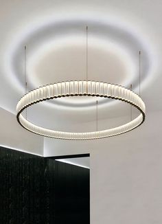 a circular light fixture hanging from the ceiling