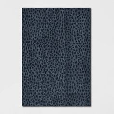 an animal print wall hanging in a room